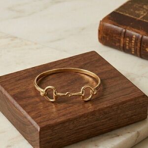 Horsebit Gold Tone Bangle Bracelet